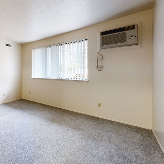 Thumbnail 3 of 9 an empty room with a window and a air conditioner at Irish Hills Apartments, Indiana, 46614