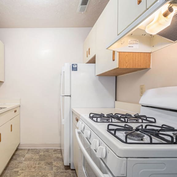 Thumbnail 5 of 6 A kitchen with a gas stove at Irish Hills Apartments, Indiana, 46614