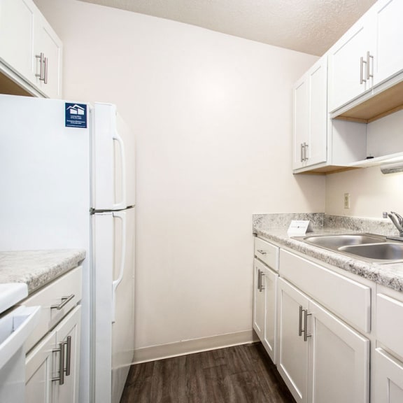 Thumbnail 5 of 10 An upgraded kitchen with white cabinets at Irish Hills Apartments, Indiana, 46614