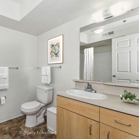 Thumbnail 7 of 10 a bathroom with a sink toilet and a mirror