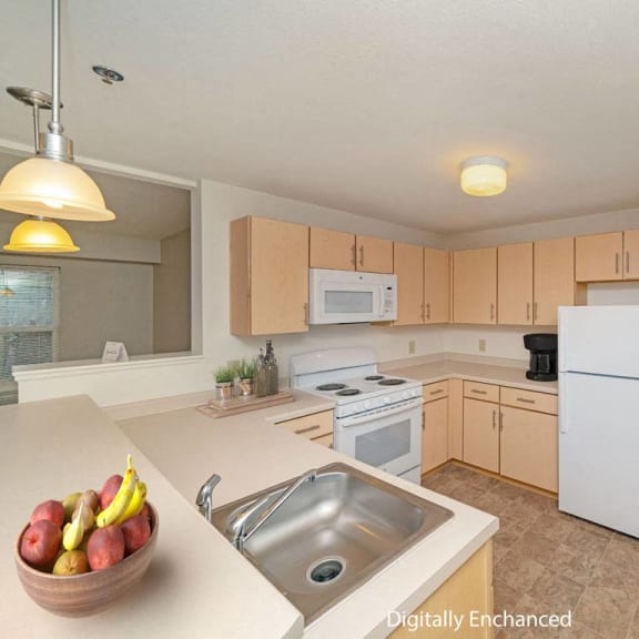 Thumbnail 5 of 10 a kitchen with white appliances and a sink