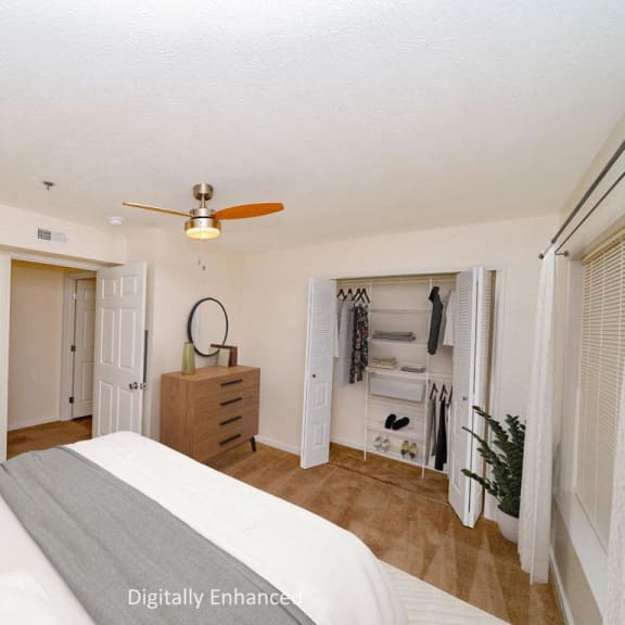 Thumbnail 8 of 8 a bedroom with a bed and a ceiling fan