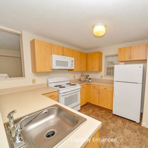 Thumbnail 6 of 8 a kitchen with white appliances and wooden cabinets