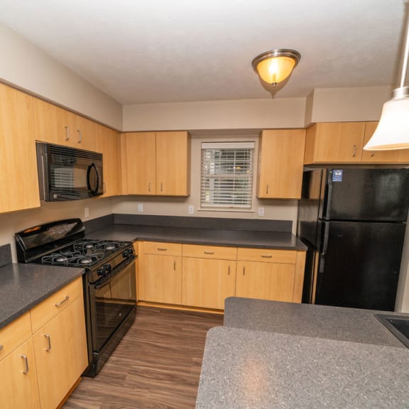 Thumbnail 5 of 15 A kitchen with an island at Lynbrook Apartments and Townhomes, Nebraska, 68022