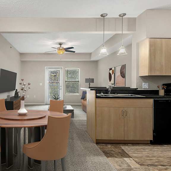 Thumbnail 3 of 12 A modern dining room with a round table and chairs at Lynbrook Apartments and Townhomes, Elkhorn, NE, 68022