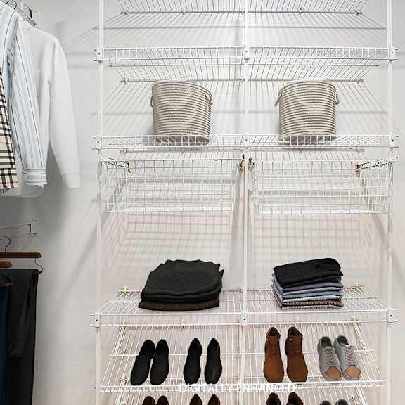 Thumbnail 11 of 12 A walk in closet with wardrobe organizers at Lynbrook Apartments and Townhomes, Elkhorn, NE, 68022