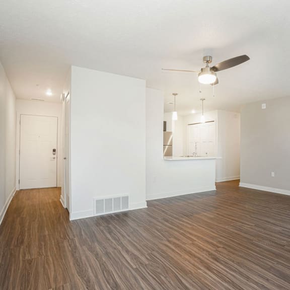 Thumbnail 4 of 9 an empty living room with a ceiling fan at Meadowbrooke Apartment Homes, Grand Rapids, 49512