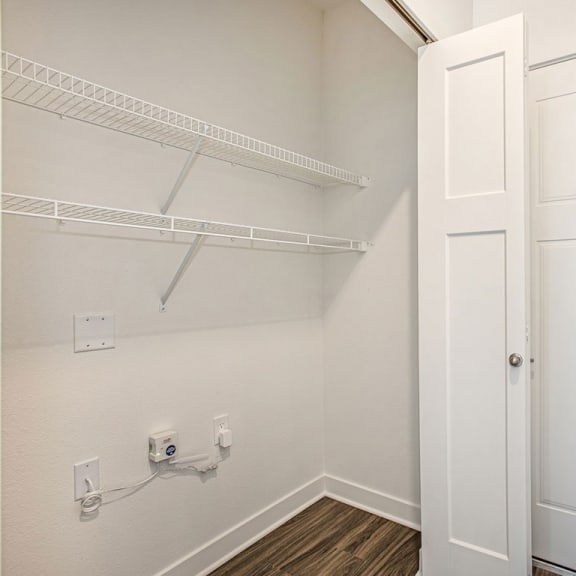 Thumbnail 3 of 8 the closet in a bedroom of a home with white doors at Meadowbrooke Apartment Homes, Grand Rapids, Michigan