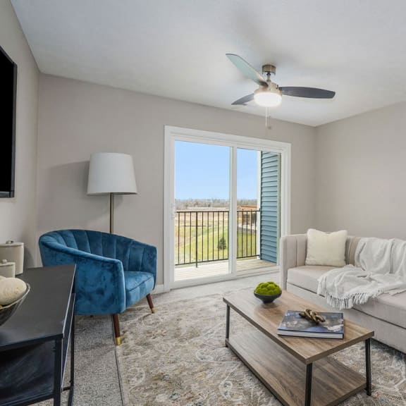 Thumbnail 4 of 12 a living room with a couch and a coffee table at Meadowbrooke Apartment Homes, Grand Rapids, 49512