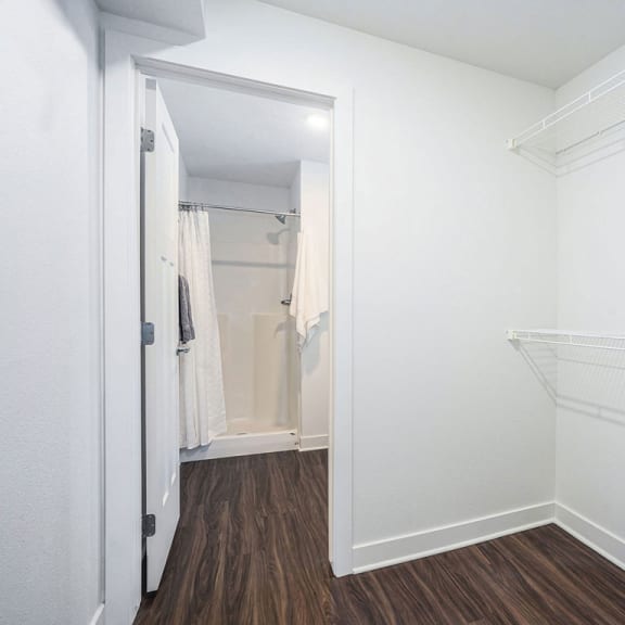 Thumbnail 10 of 10 a closet in a bedroom with a mirrored closet door at Meadowbrooke Apartment Homes, Grand Rapids