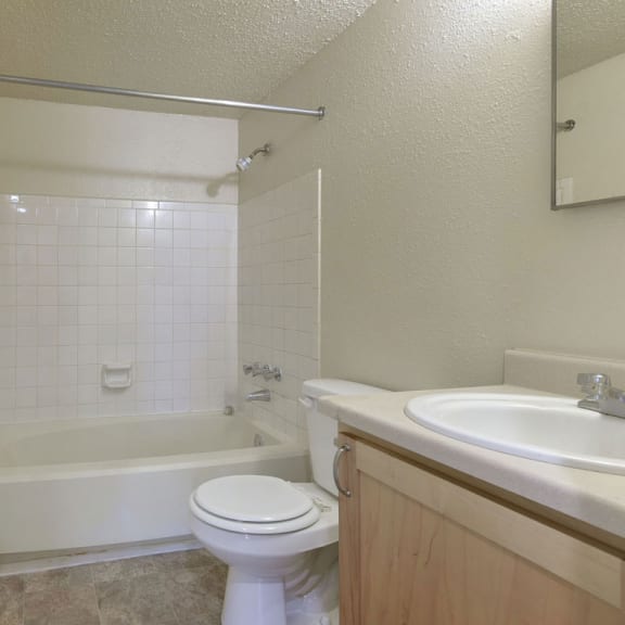 Thumbnail 7 of 11 a bathroom with a sink toilet and a bath tub at Old Monterey Apartments, Missouri