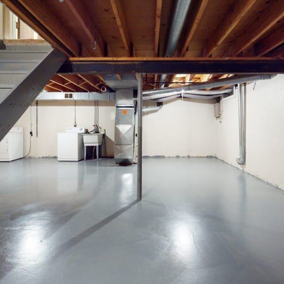 Thumbnail 9 of 9 a large garage with a steel floor and stairs at Mount Royal Townhomes, Michigan, 49009