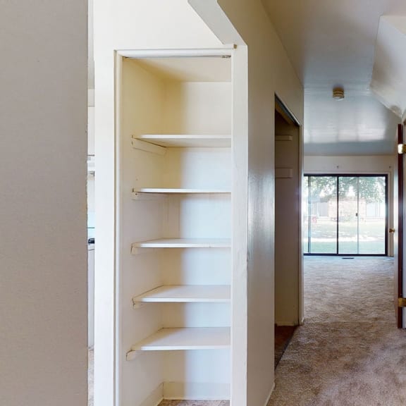 Thumbnail 3 of 13 a view of a house with stairs and a hallway at Mount Royal Townhomes, Kalamazoo, 49009