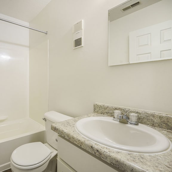 Thumbnail 9 of 11 a bathroom with hard-surface flooring at Newport Village Apartments in Portage, MI