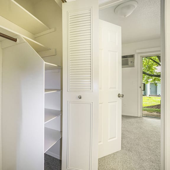 Thumbnail 8 of 11 a large closet with shelves at Newport Village Apartments in Portage, MI