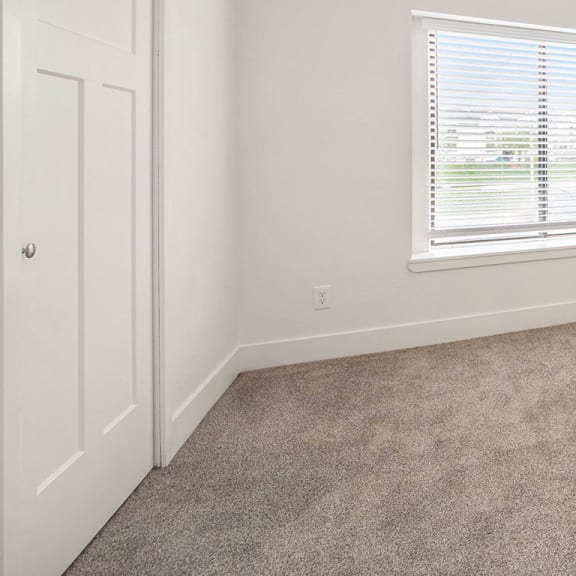 Thumbnail 6 of 7 Bedroom with carpet and a window at North Pointe Apartments in Elkhart, IN