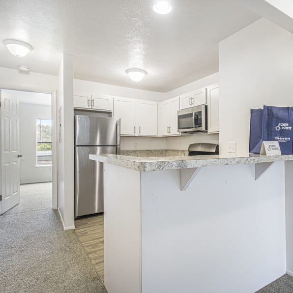 Thumbnail 7 of 17 two bedroom kitchen with snack bar at North Pointe Apartments, Indiana, 46514