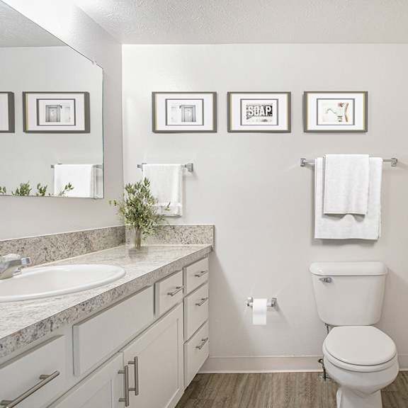 Thumbnail 12 of 18 full bathroom with white cabinetry and hard surface flooring at North Pointe Apartments, Indiana, 46514