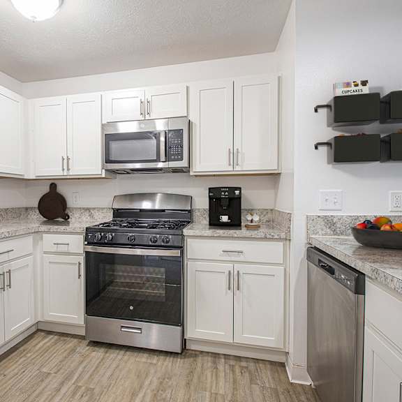 Thumbnail 8 of 18 upgraded kitchen with stainless steel appliances and white cabinets at North Pointe Apartments, Indiana, 46514