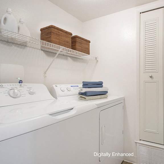 Thumbnail 11 of 17 a laundry room with a washer and dryer at North Pointe Apartments, Indiana, 46514