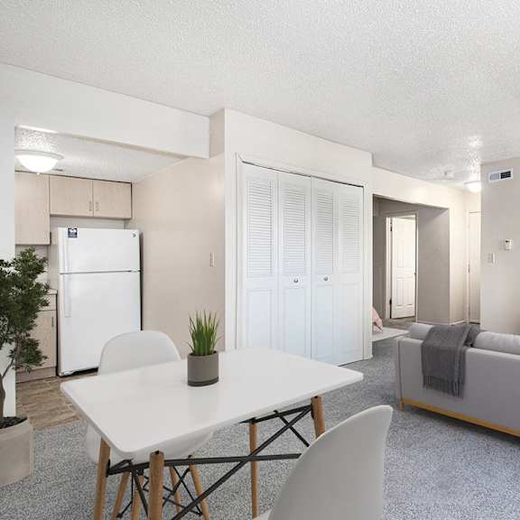 Thumbnail 5 of 12 a dining room with a table and carpet a bathroom with a sink toilet and a mirror at Old Farm Apartments, Elkhart, 46517