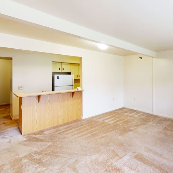 Thumbnail 5 of 12 the living room and kitchen at Orchard Lakes Apartments, Toledo, 43615