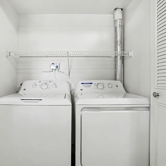 Thumbnail 13 of 17 A full size washing machine  and dryer at Pine Knoll Apartments, Battle Creek