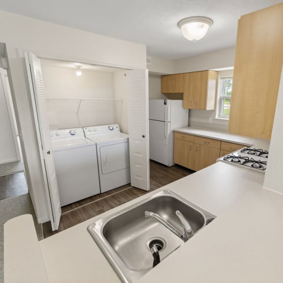 Thumbnail 8 of 12 a kitchen with a washer and dryer at Hunters Pond Apartment Homes, Champaign, Illinois