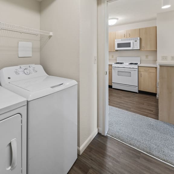 Thumbnail 10 of 18 laundry room with a washer and a dryer  at Hunters Pond Apartment Homes, Champaign