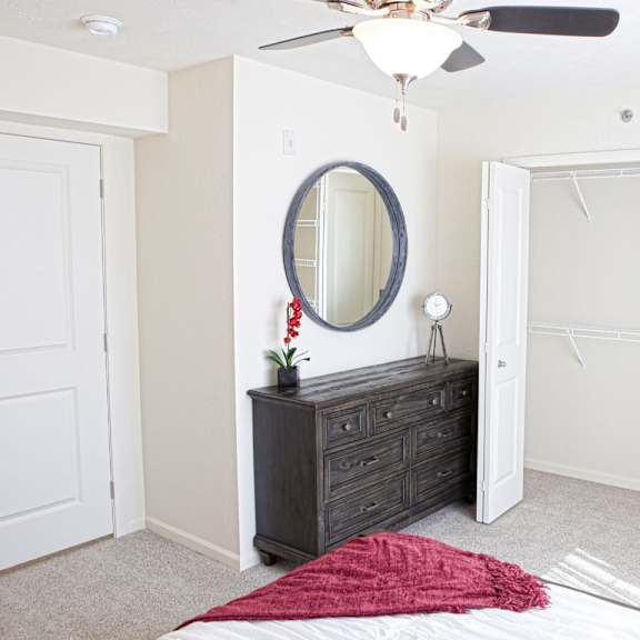 Thumbnail 8 of 9 A bedroom with a walk-in closet at The Reserve at Destination Pointe, Grimes