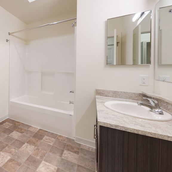 Thumbnail 6 of 10 a bathroom with a sink toilet and a shower at The Reserve at Destination Pointe, Grimes, 50111