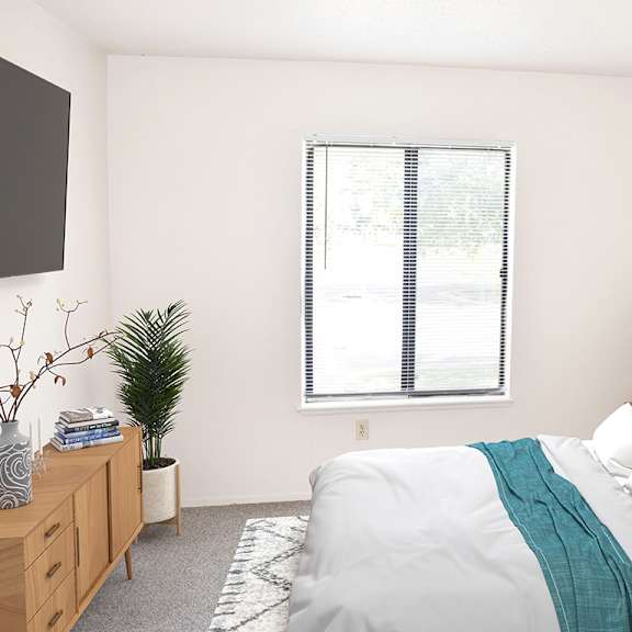 Thumbnail 15 of 18 a bedroom with a window at Seville Apartments, Michigan, 49009