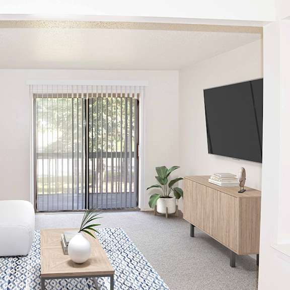 Thumbnail 3 of 18 a living room leading to private balcony at Seville Apartments, Michigan, 49009