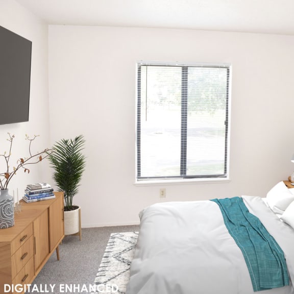 Thumbnail 9 of 10 a bedroom with a window at Seville Apartments, Michigan, 49009