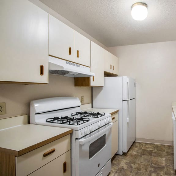 Thumbnail 7 of 10 galley style kitchen at Seville Apartments, Kalamazoo, Michigan