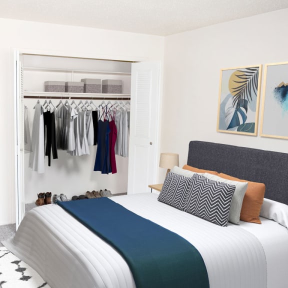 Thumbnail 10 of 13 a bedroom with a closet full of clothes at Seville Apartments, Kalamazoo, MI, 49009