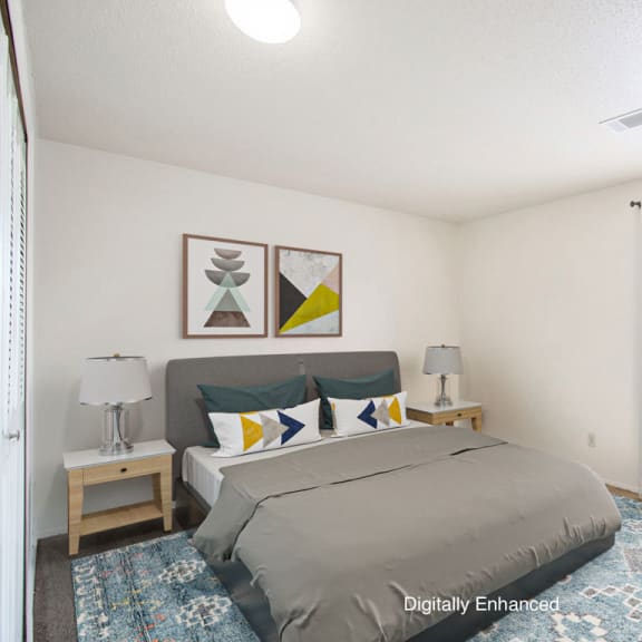 Thumbnail 12 of 13 a bedroom with a bed and window at Seville Apartments, Kalamazoo, MI, 49009