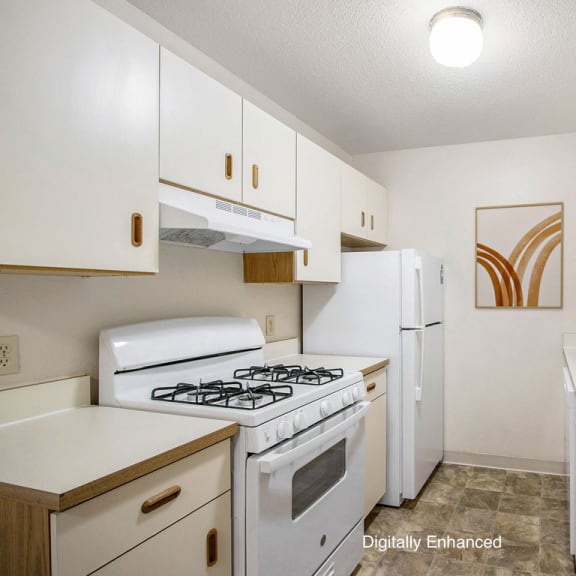 Thumbnail 8 of 13 a kitchen with a stove refrigerator and sink at Seville Apartments, Kalamazoo, MI, 49009