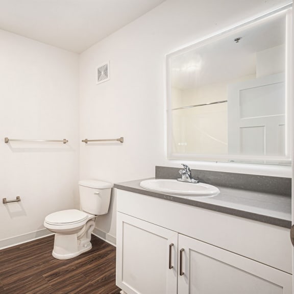 Thumbnail 10 of 12 a bathroom with a window and a lighted mirror  at Signature Pointe Apartment Homes, Athens, AL