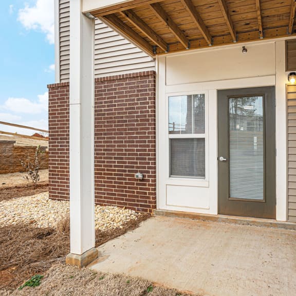 Thumbnail 5 of 12 Private patio with a door to enclosed storage  at Signature Pointe Apartment Homes, Alabama, 35611