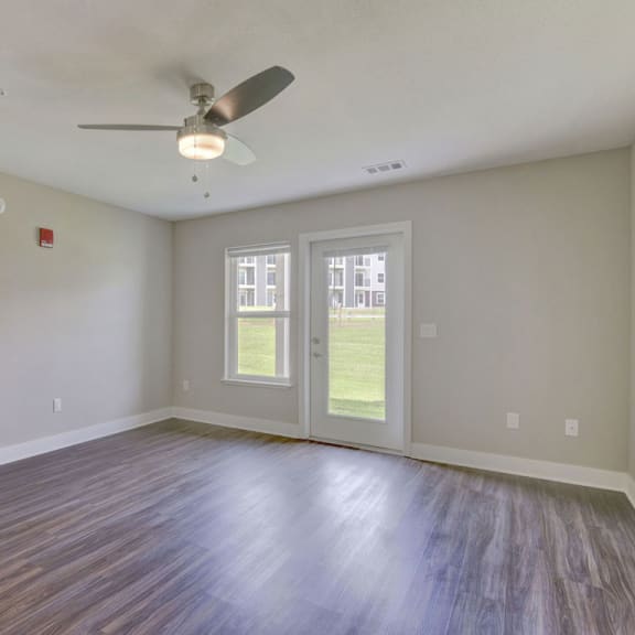 Thumbnail 7 of 22 living room with a ceiling fan and wood floors  at Signature Pointe Apartment Homes, Alabama, 35611