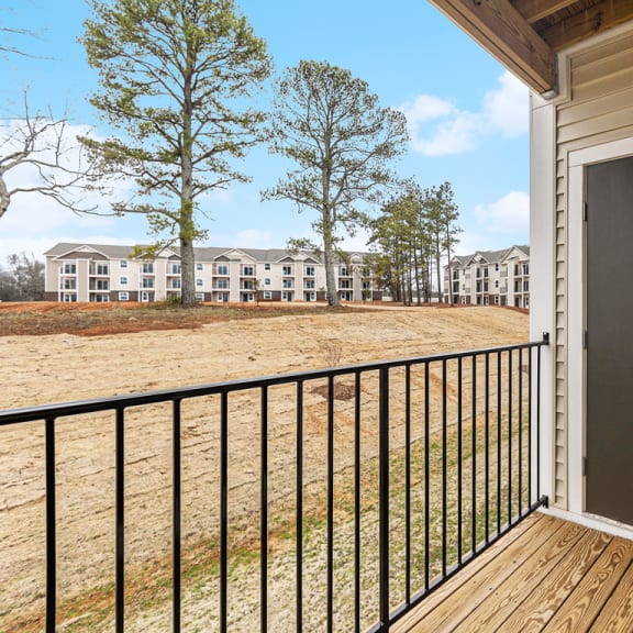 Thumbnail 6 of 22 Private balcony with enclosed storage overlooking apartment community  at Signature Pointe Apartment Homes, Athens, AL, 35611