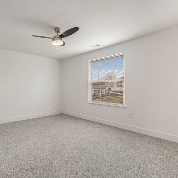 Thumbnail 20 of 22 Large bedroom with a ceiling fan and a window  at Signature Pointe Apartment Homes, Athens