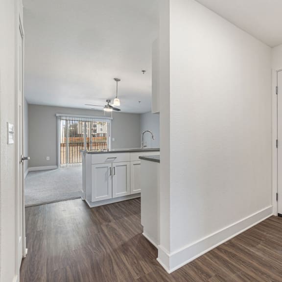 Thumbnail 3 of 22 Entry to kitchen and living room with hard surface floors  at Signature Pointe Apartment Homes, Athens, AL, 35611