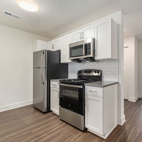 Thumbnail 13 of 22 kitchen with hard surface flooring  at Signature Pointe Apartment Homes, Alabama