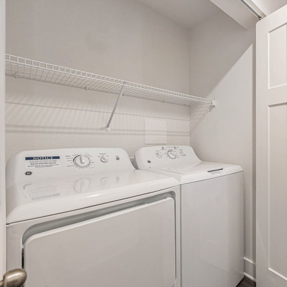 Thumbnail 4 of 22 a washer and dryer in a laundry room  at Signature Pointe Apartment Homes, Athens, 35611