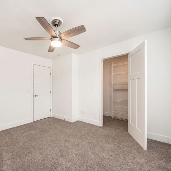 Thumbnail 14 of 14 Bedroom with a ceiling fan and a walk in closet  at Signature Pointe Apartment Homes, Alabama