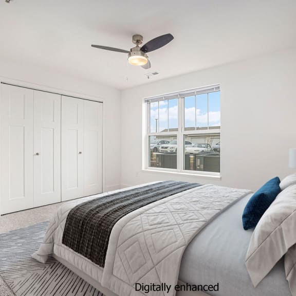 Thumbnail 12 of 14 Spacious bedroom with ceiling fan and large window at Signature Pointe Apartment Homes in Athens, AL