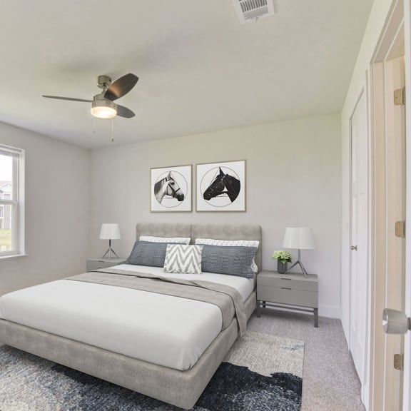 Thumbnail 19 of 22 a bedroom with a bed and a ceiling fan  at Signature Pointe Apartment Homes, Athens, Alabama
