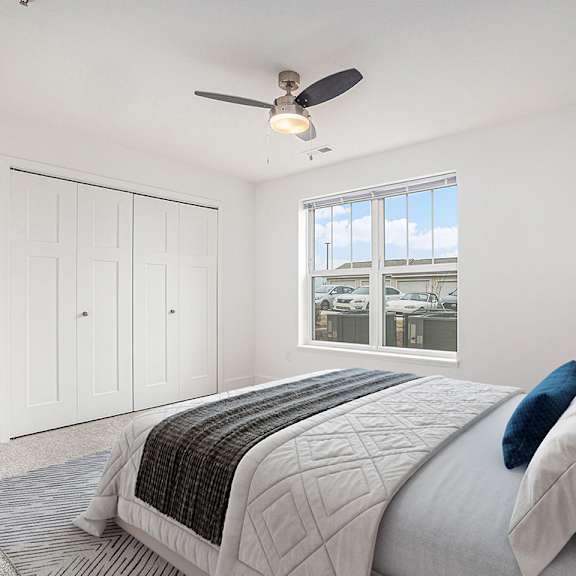 Thumbnail 12 of 14 Spacious bedroom with ceiling fan and large window at Signature Pointe Apartment Homes in Athens, AL